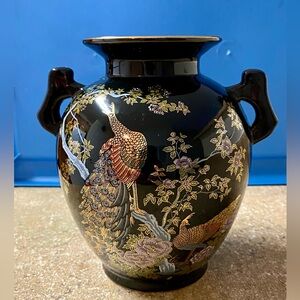 Vintage black with gold trim vase with peacock and peony floral design.
